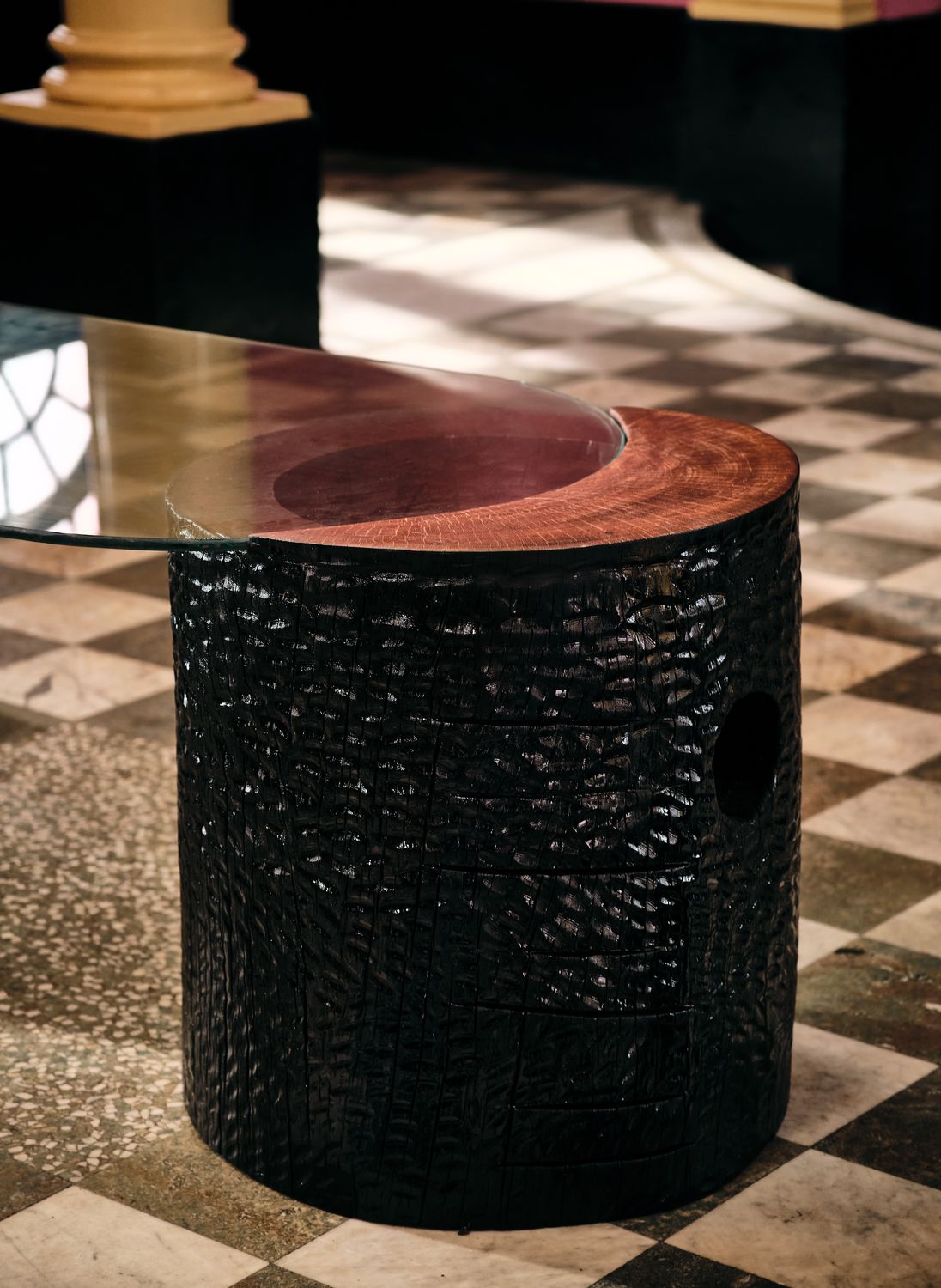 The round base from the side, showing the opening in its carving